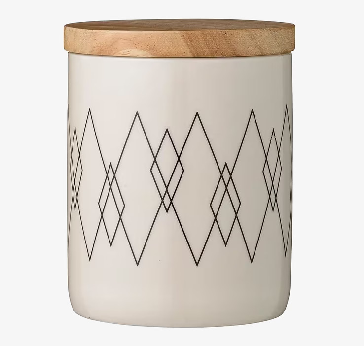 Foto av stilren vit och svart porslinsburk med lock