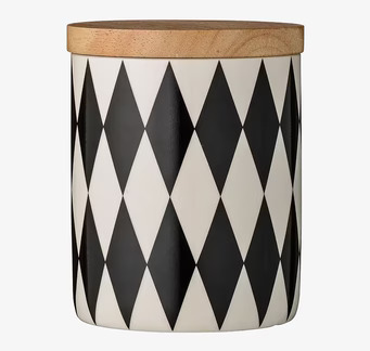 Bild av stilren porslinsburk med trälock och mönster