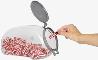 Bild av glasburk fylld med polkagrisar och metallock