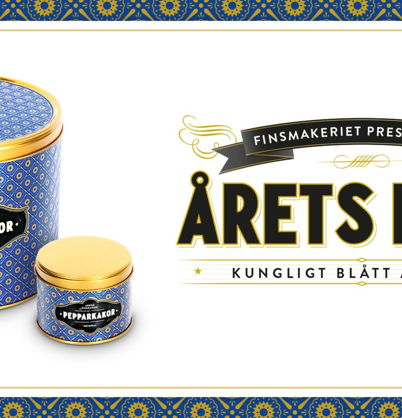 Bild av eleganta blå plåtburkar med gyllene lock