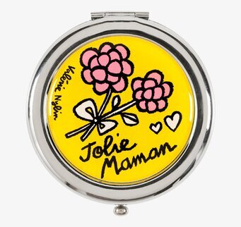 Bild av rund fickspegel med blommigt konstmotiv