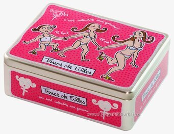 Bild av cerise plåtburk med lekfullt prickmönster